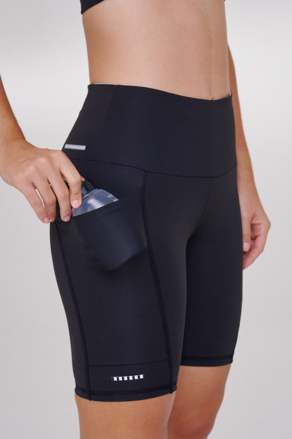 BERMUDA CORE 3 BOLSOS 18CM